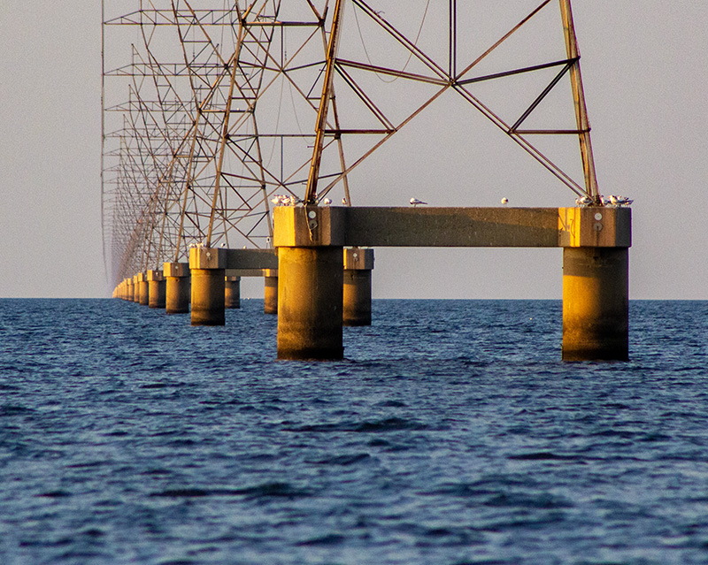 many transmission towers in a row over lake pontchartrain